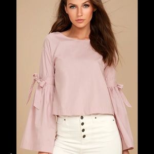 Super cute blouse with exaggerated bell sleeves!